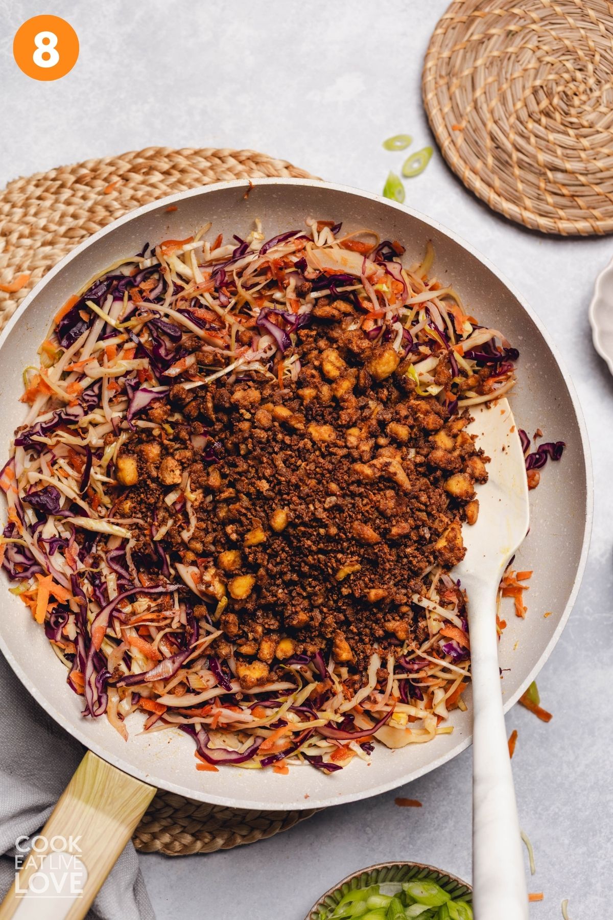 Crumbled tofu added into the vegetable mixture.