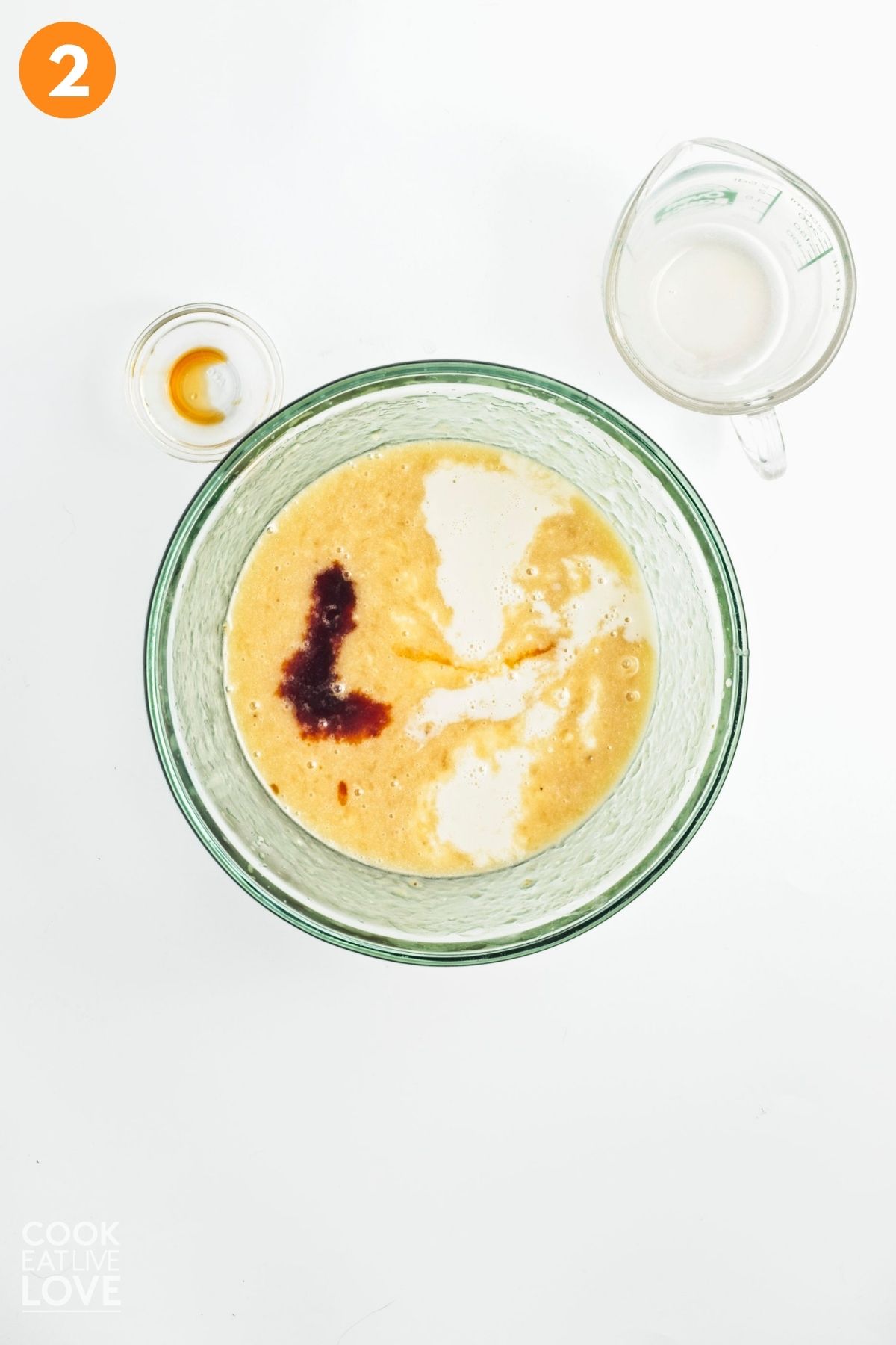 Oat milk and vanilla extract added into the banana mixture.