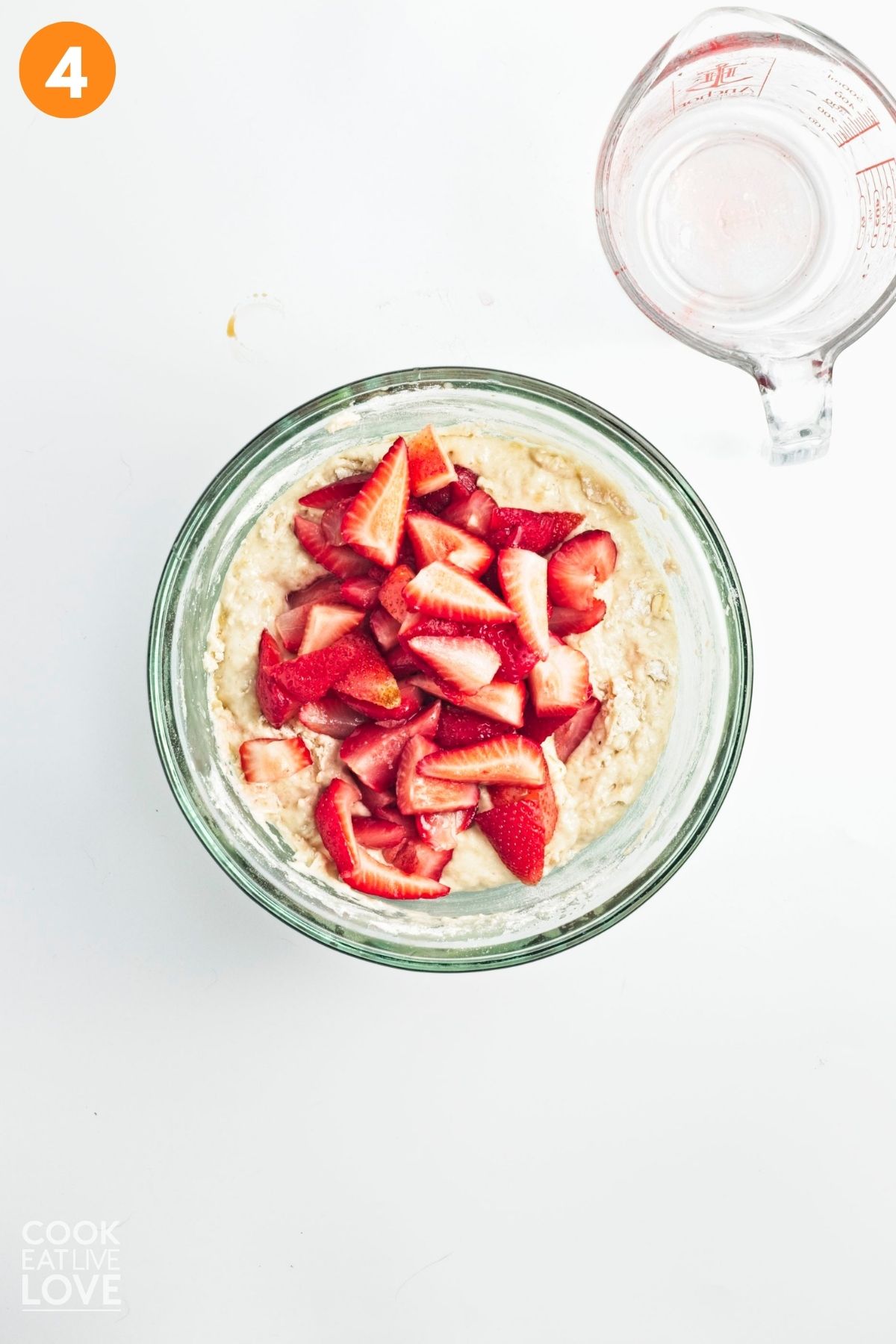 Strawberries carefully folded into the banana batter.