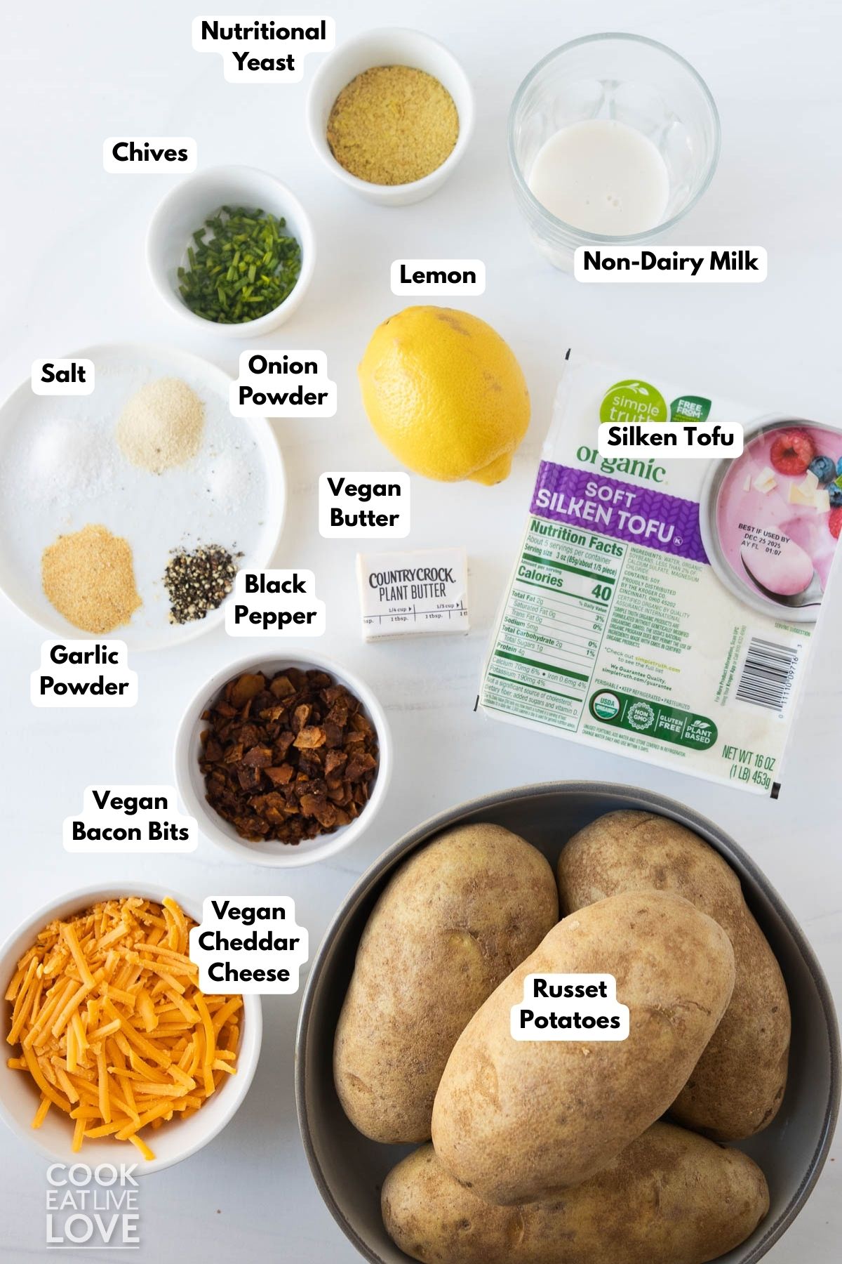 Ingredients to make vegan twice-baked potatoes on a table.