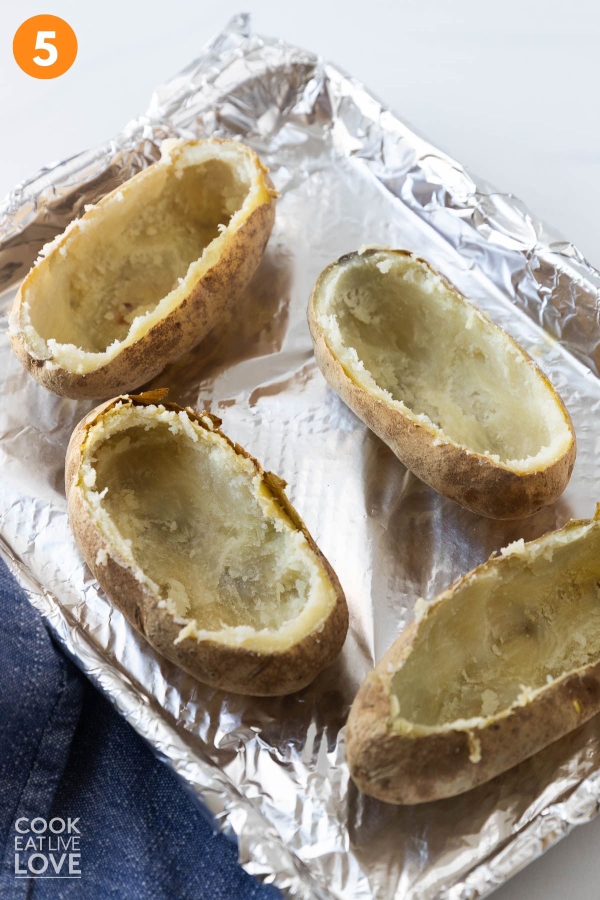 Potato skins with the potato flesh scooped out. 