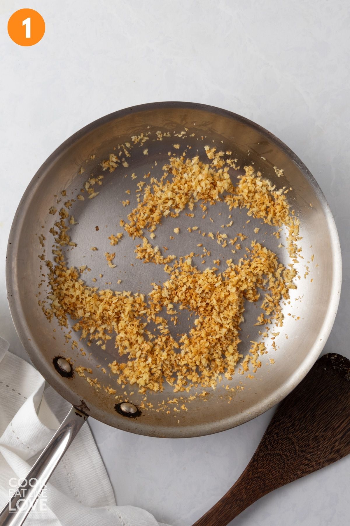 Panko toasting in a pan.