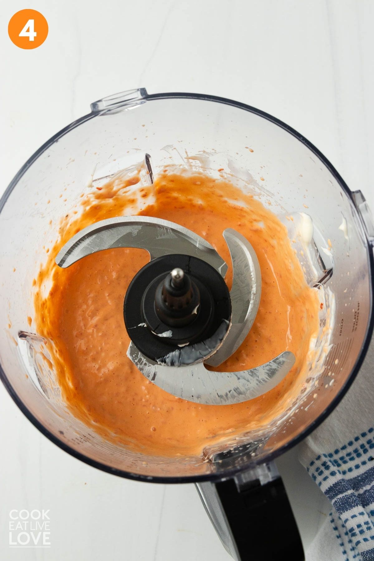 The red pepper aioli ingredients into a food processor.