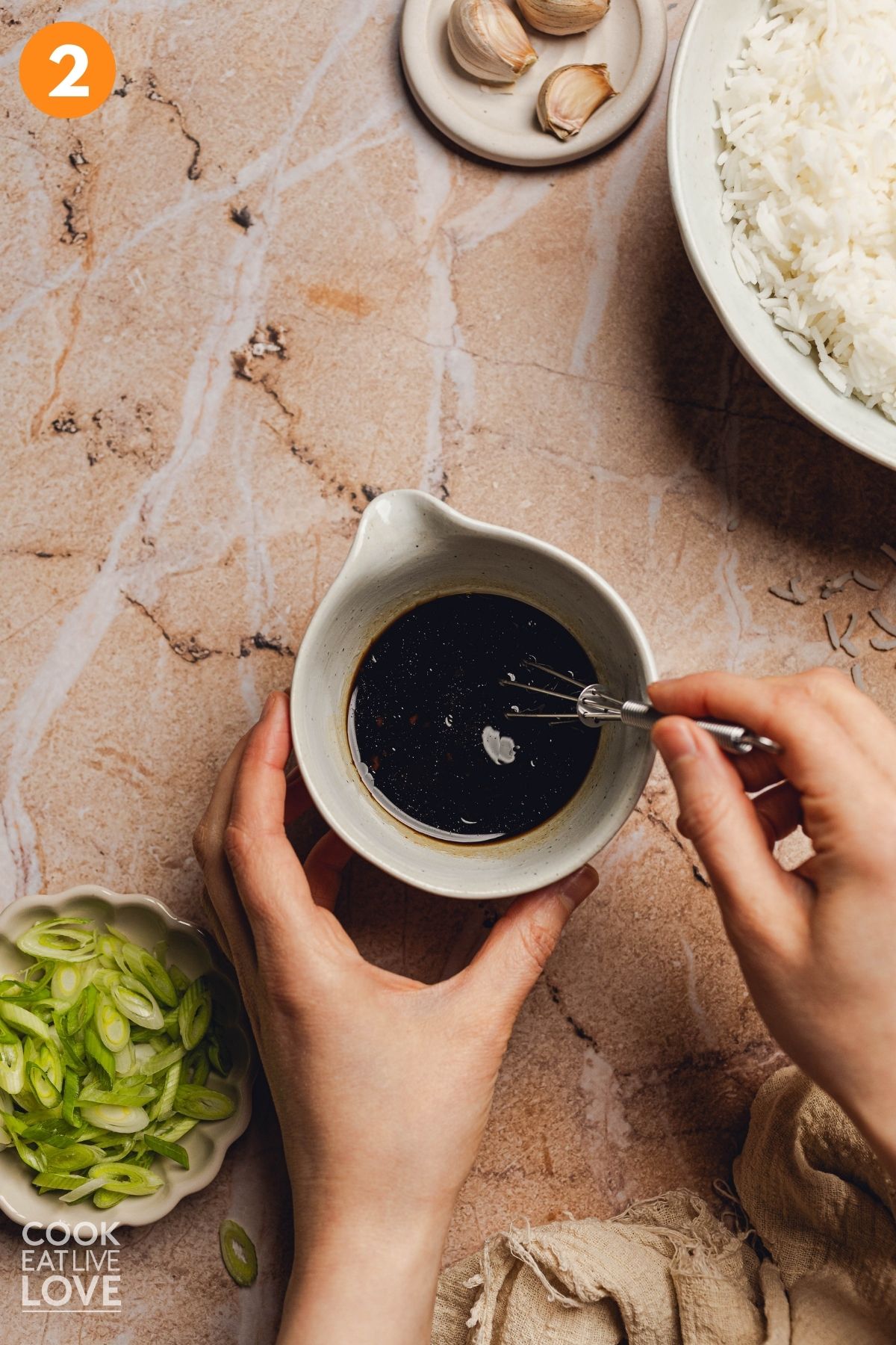 Soy sauce, hoisin sauce, rice vinegar, sesame oil, and sriracha being combined.