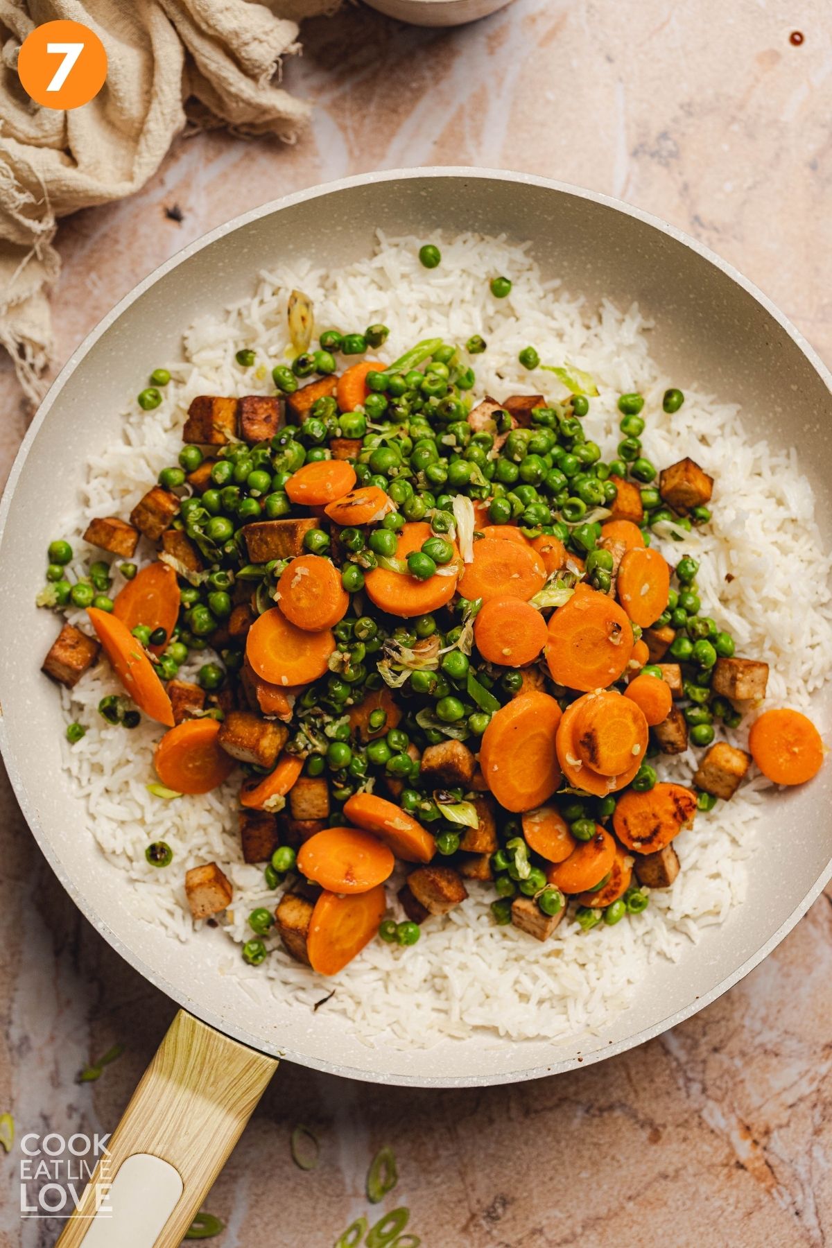 The veggie mixture added to the white rice.