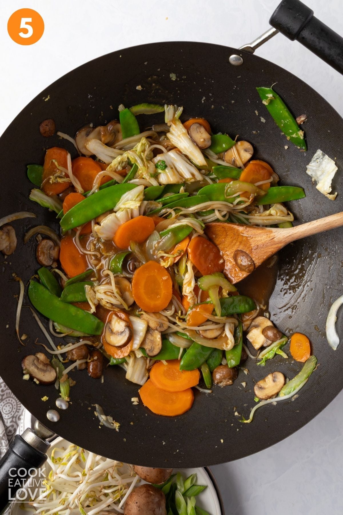Vegetable chop suey at the end of cooking with the sauce and tender vegetables still in the wok. 