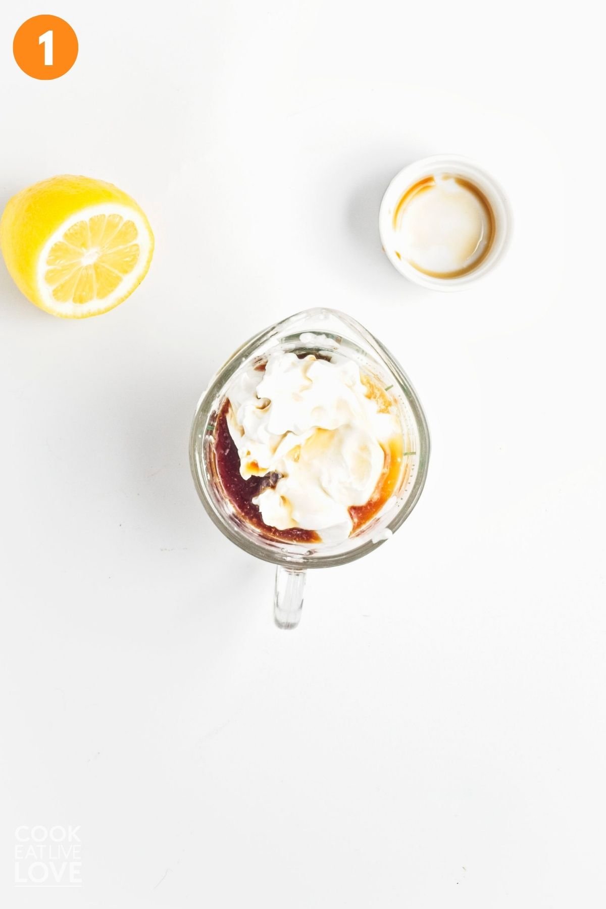 Coconut cream, vanilla, and lemon juice in a small bowl.