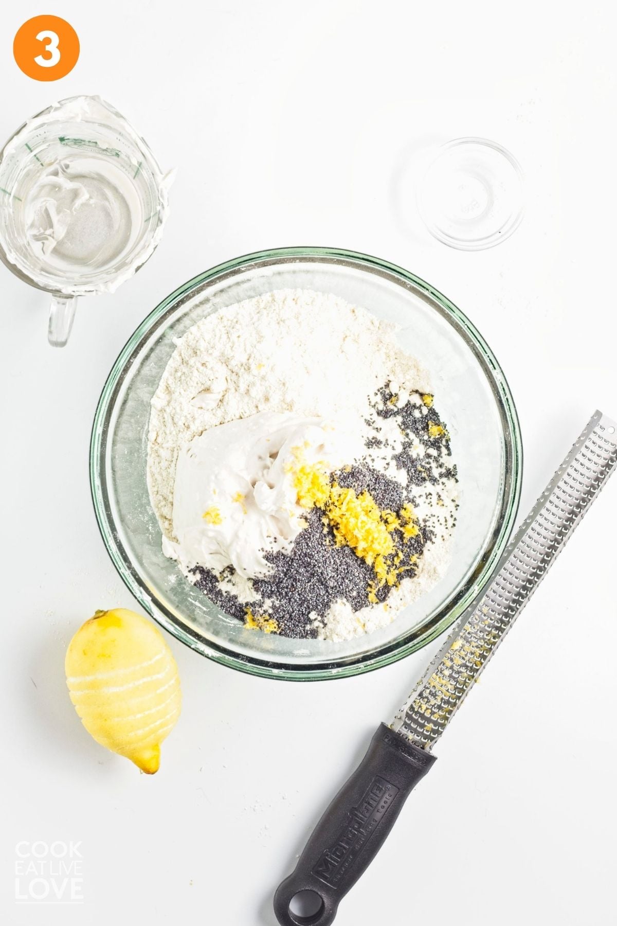 Lemon zest and poppy seeds added to the dry ingredients.