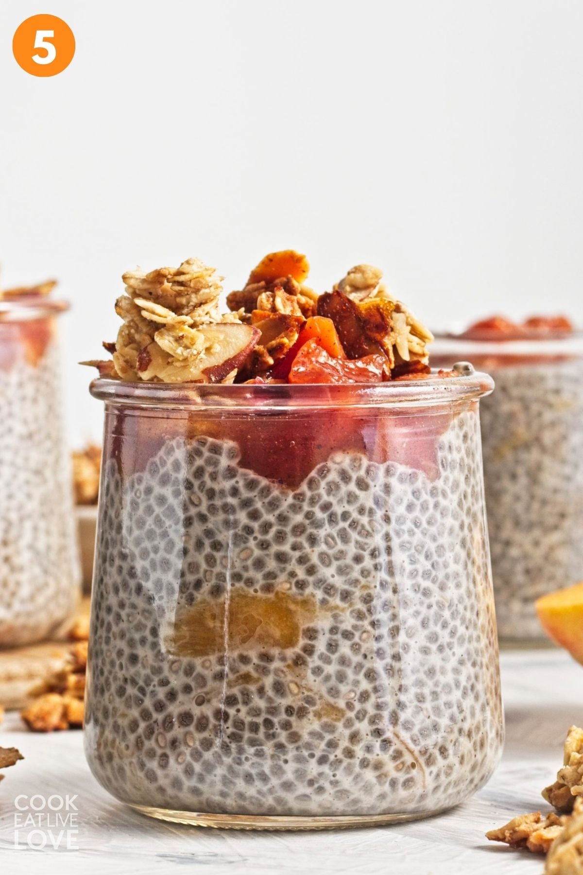 Pudding divided into serving dishes and peach mixture added to the top.