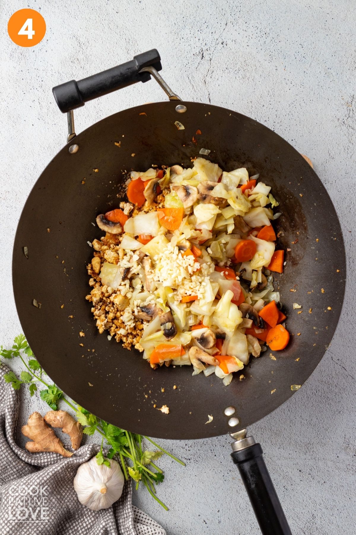 The cabbage, carrots and mushrooms added to the tofu.