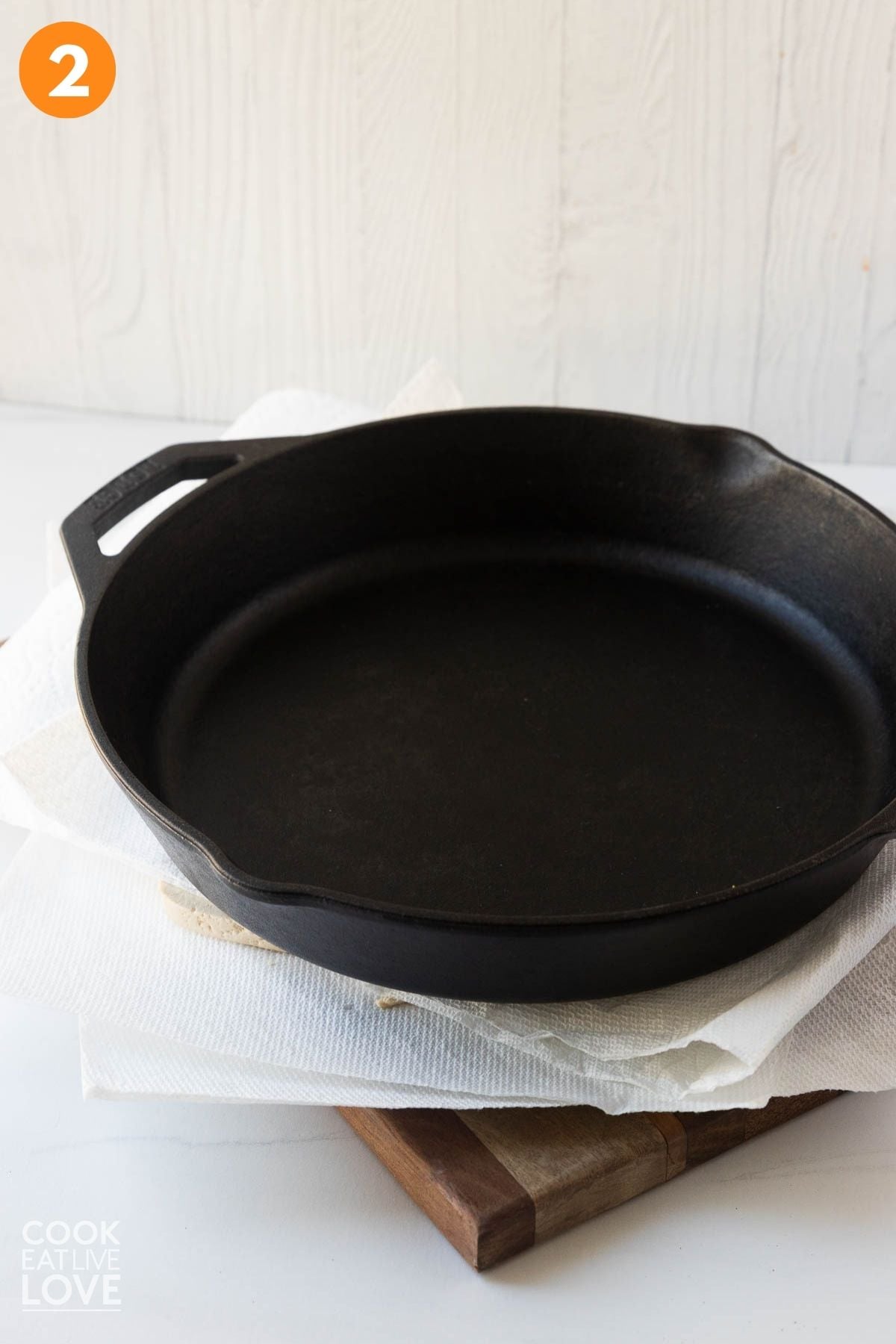 A heavy pan over top of the tofu to take out the moisture.