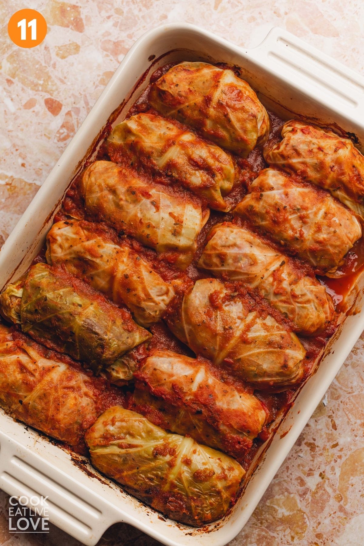 Cabbage rolls added into the casserole dish and baked.