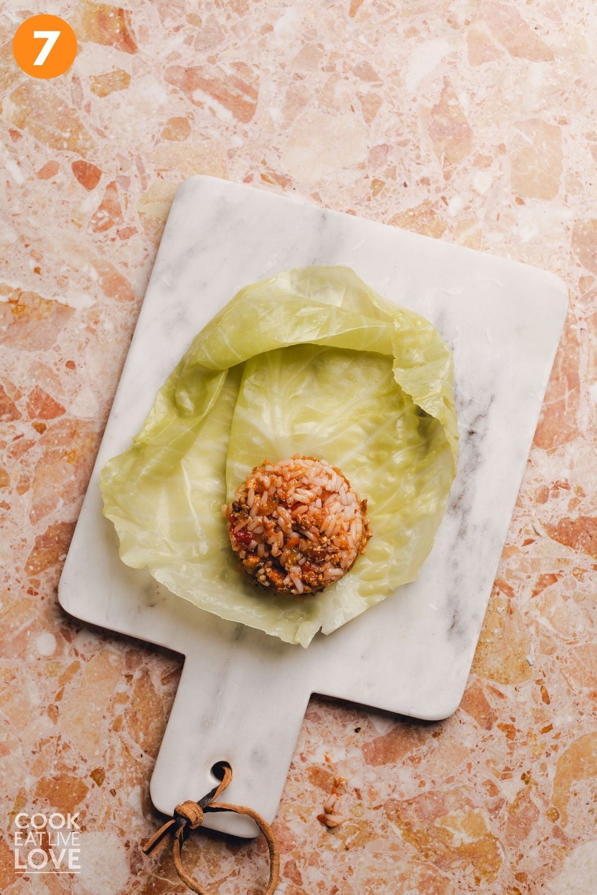 The filling on the cabbage leaf to be rolled.