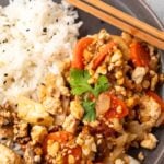 Pinterest graphic with image of tofu cabbage stir fry and text on top.