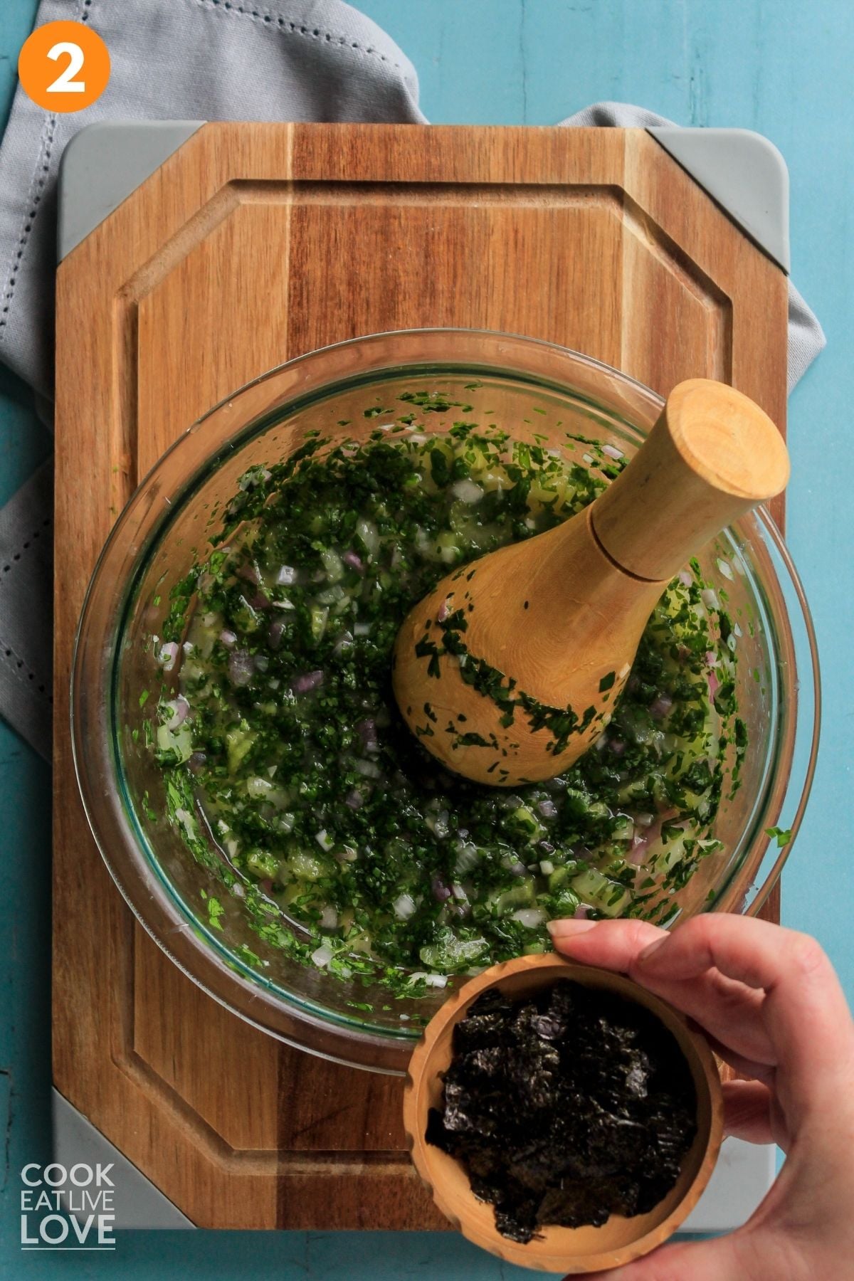 Vegetables crushed with a pestle in a bowl. 
