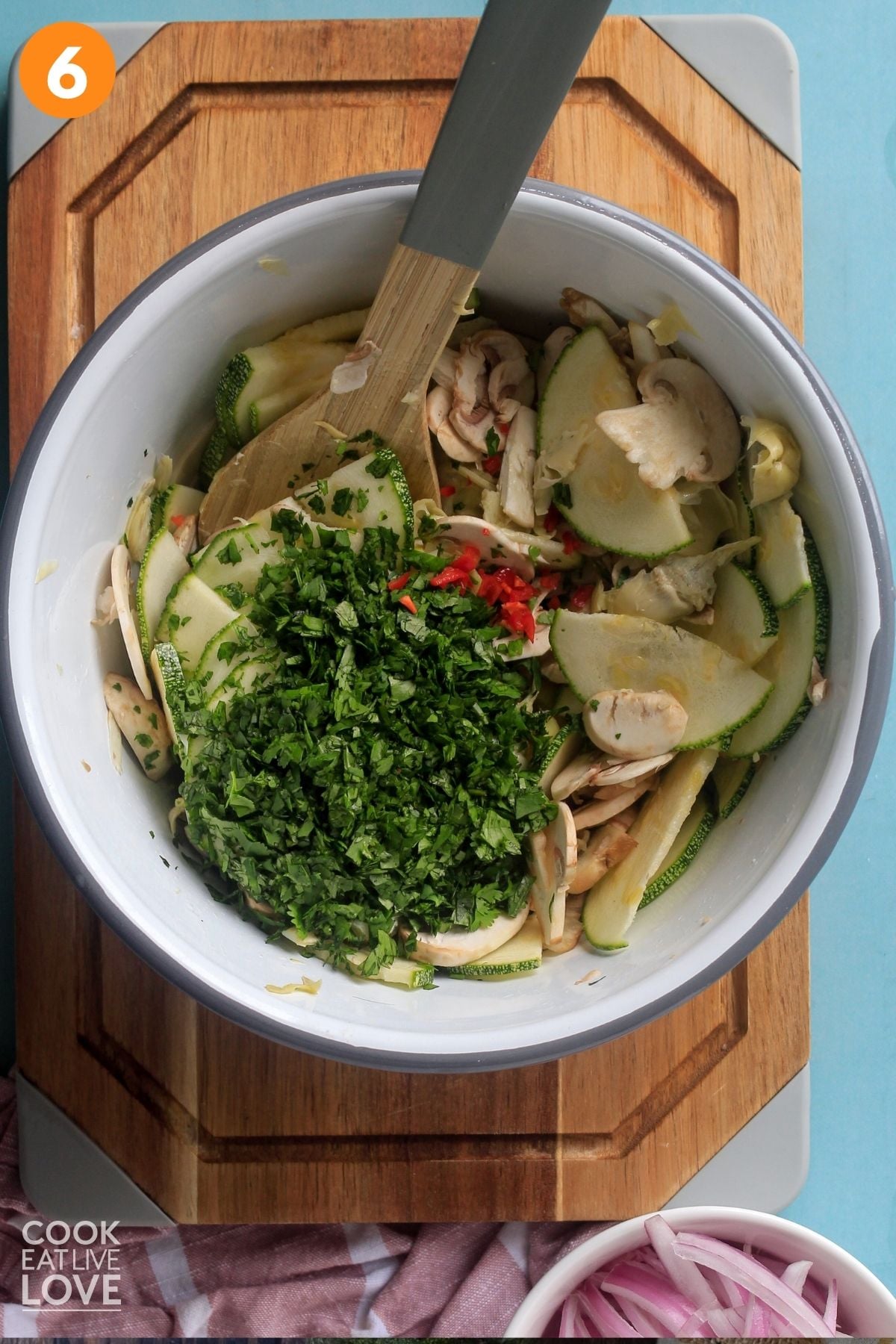 Cilantro added to the vegetables and marinade. 