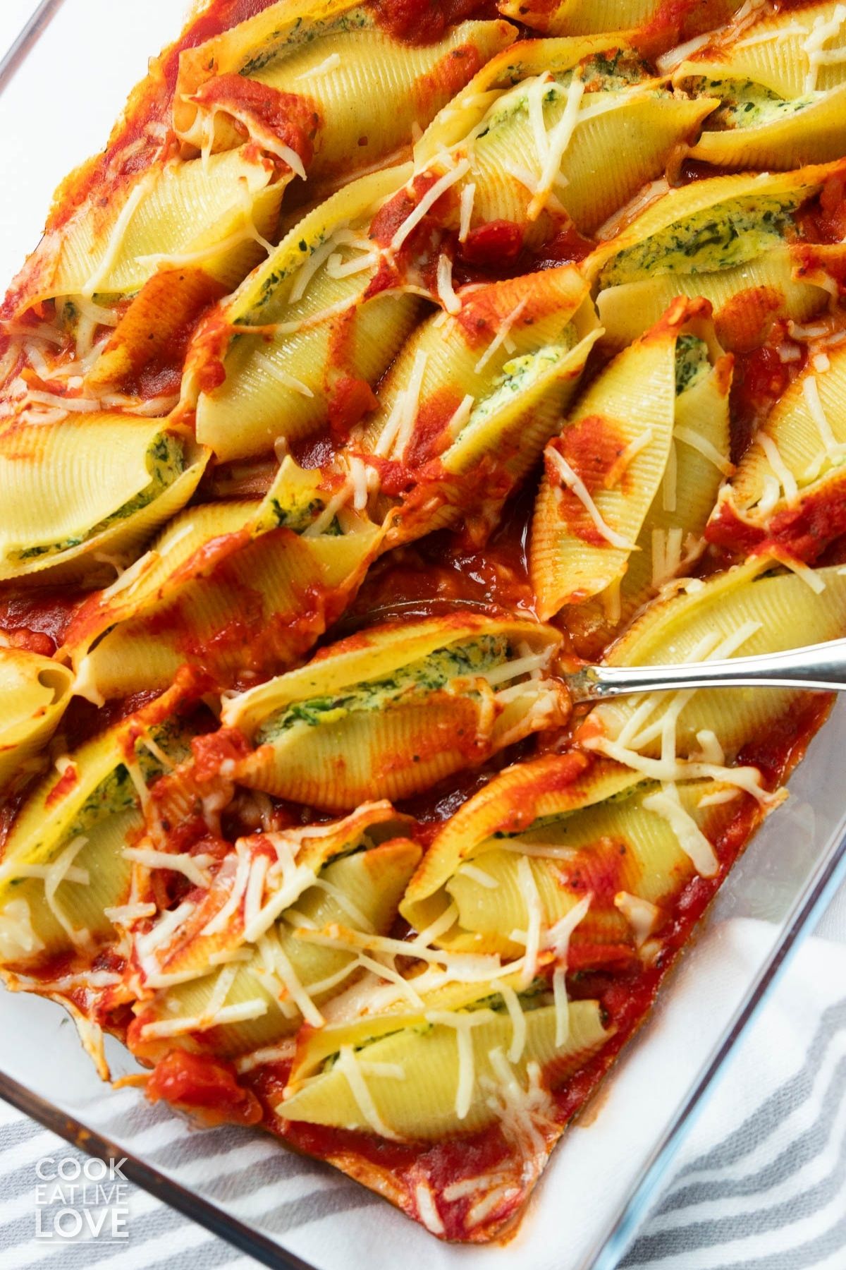 Vegan stuffed shells in a baking dish. 