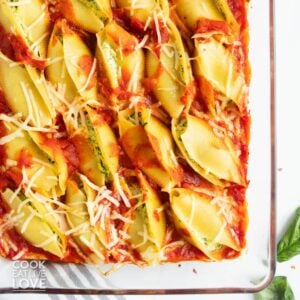 Vegan stuffed shells with tofu ricotta in a baking dish.