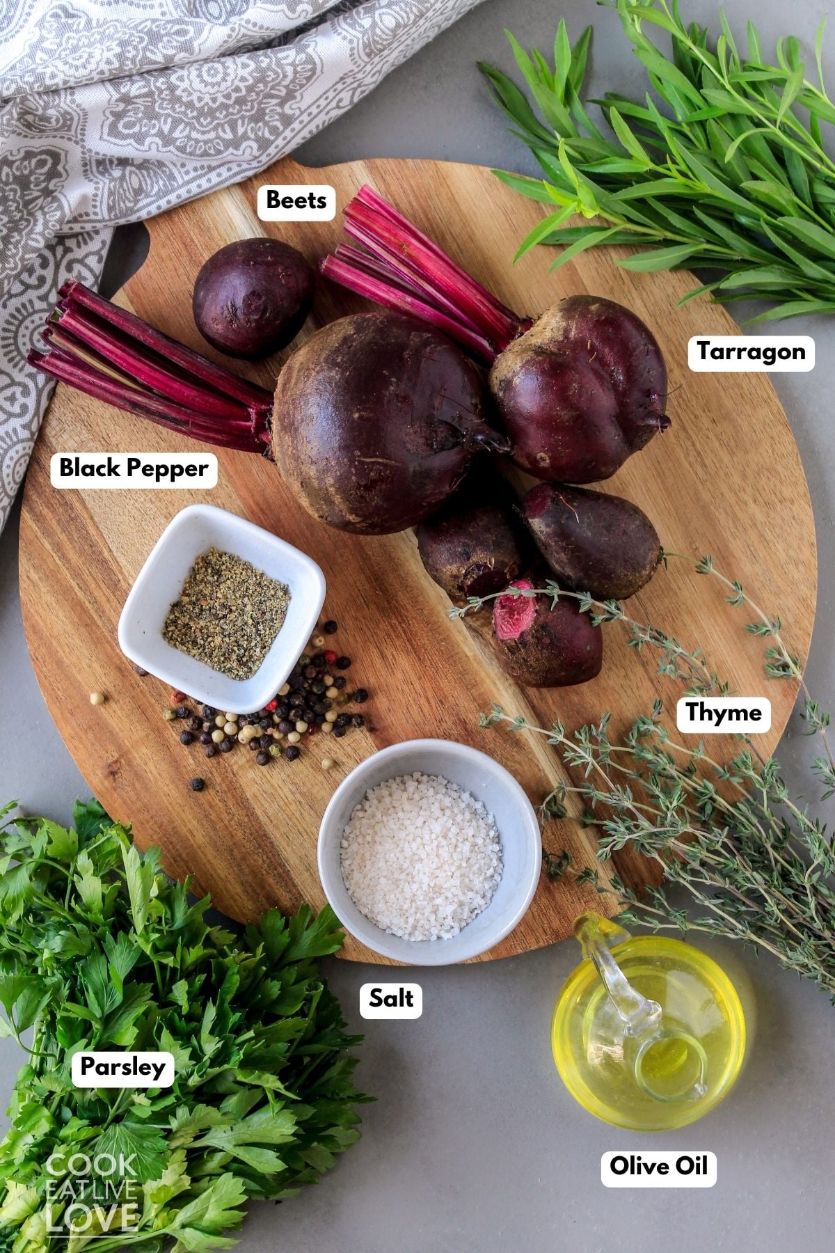 Ingredients to make this roasted beets recipe on a table with text labels. 