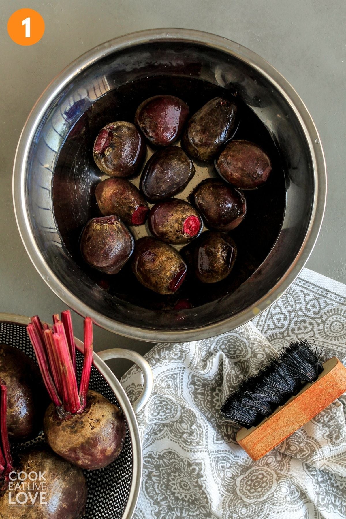 Beets in a strainer for cleaning