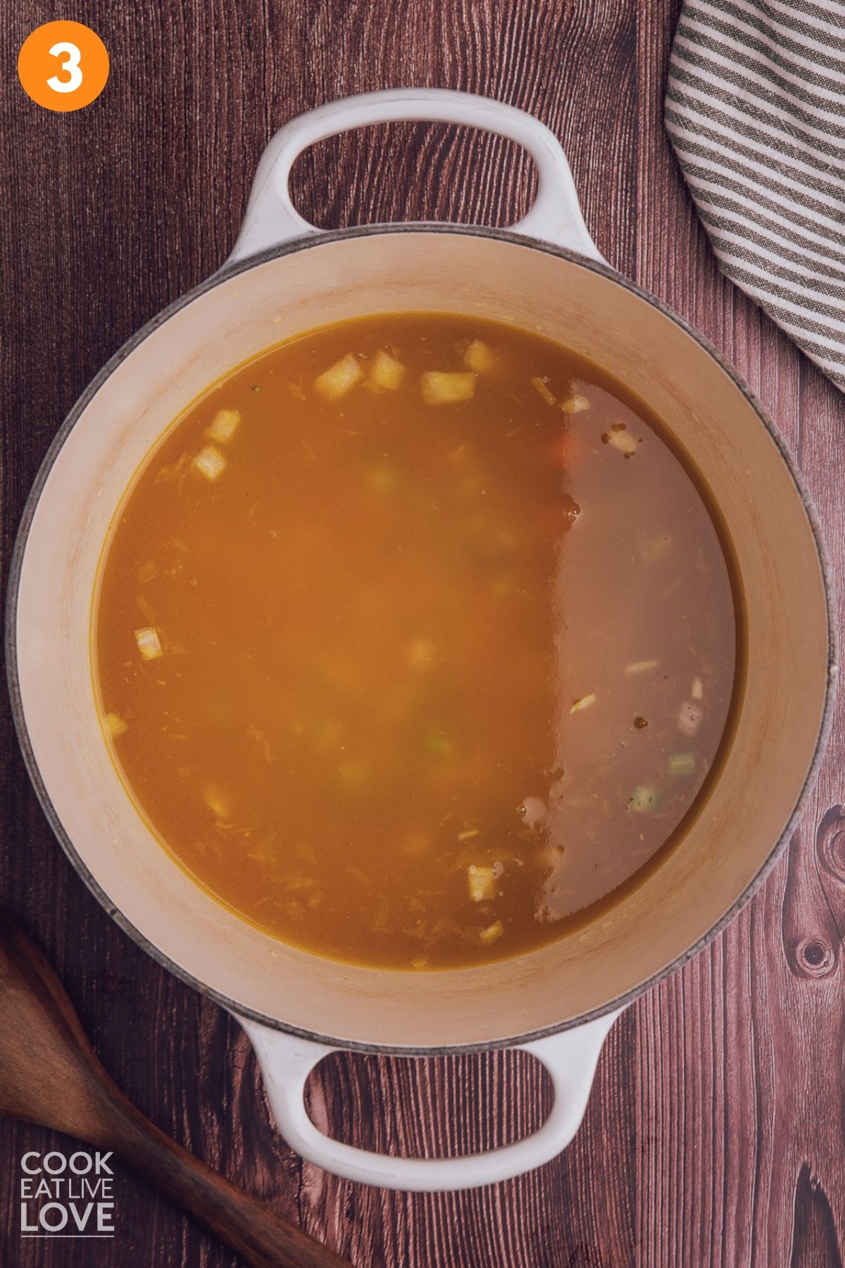 Broth added to the pot. 